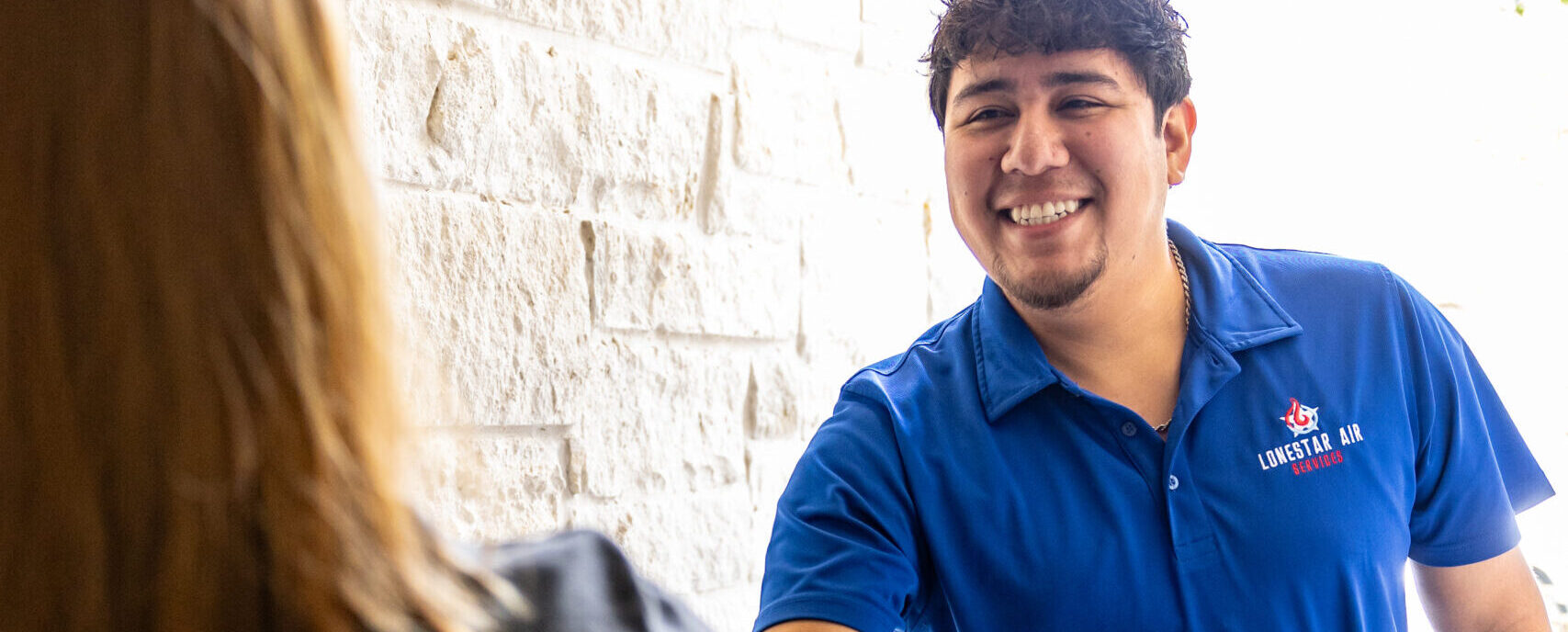 Lonestar Air Services Technician Greeting Customer at The Door